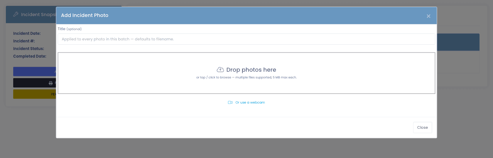 Add Incident Photo modal — title field, drop-photos drop zone with multi-file support, and a "Or use a webcam" option for capturing damage directly from the help-desk machine